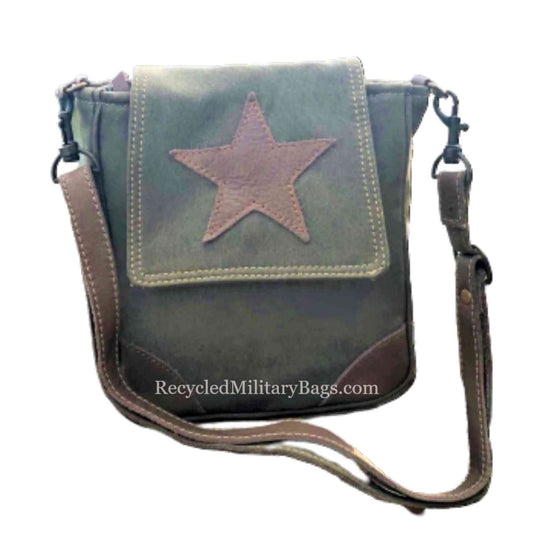 A sustainable canvas smaller crossbody bag with a brown leather star purse, featuring an adjustable strap and a zip top closure.