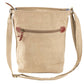 patriotic crossbody with pink cowgirl boots sitting in front of an American flag.