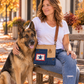recycled military bags Blue Star Crossbody for active duty military families being worn by a woman with her dog.