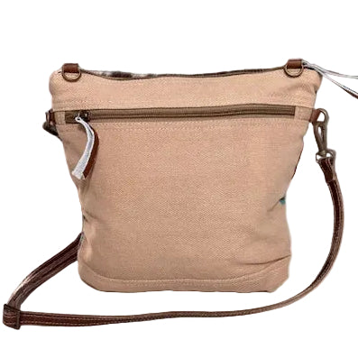 Beige back of the turquoise recycled military bag with brown strap.