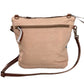 Beige back of the turquoise recycled military bag with brown strap.