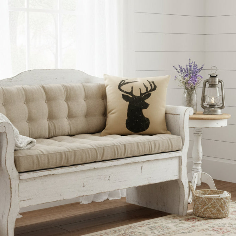 Recycled Military Bags tan pillow with black deer silhouette on a shabby chic setting
