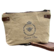 queen bee pouch or call all with a bee  in a circle of a crown. detachable wristlet strap.