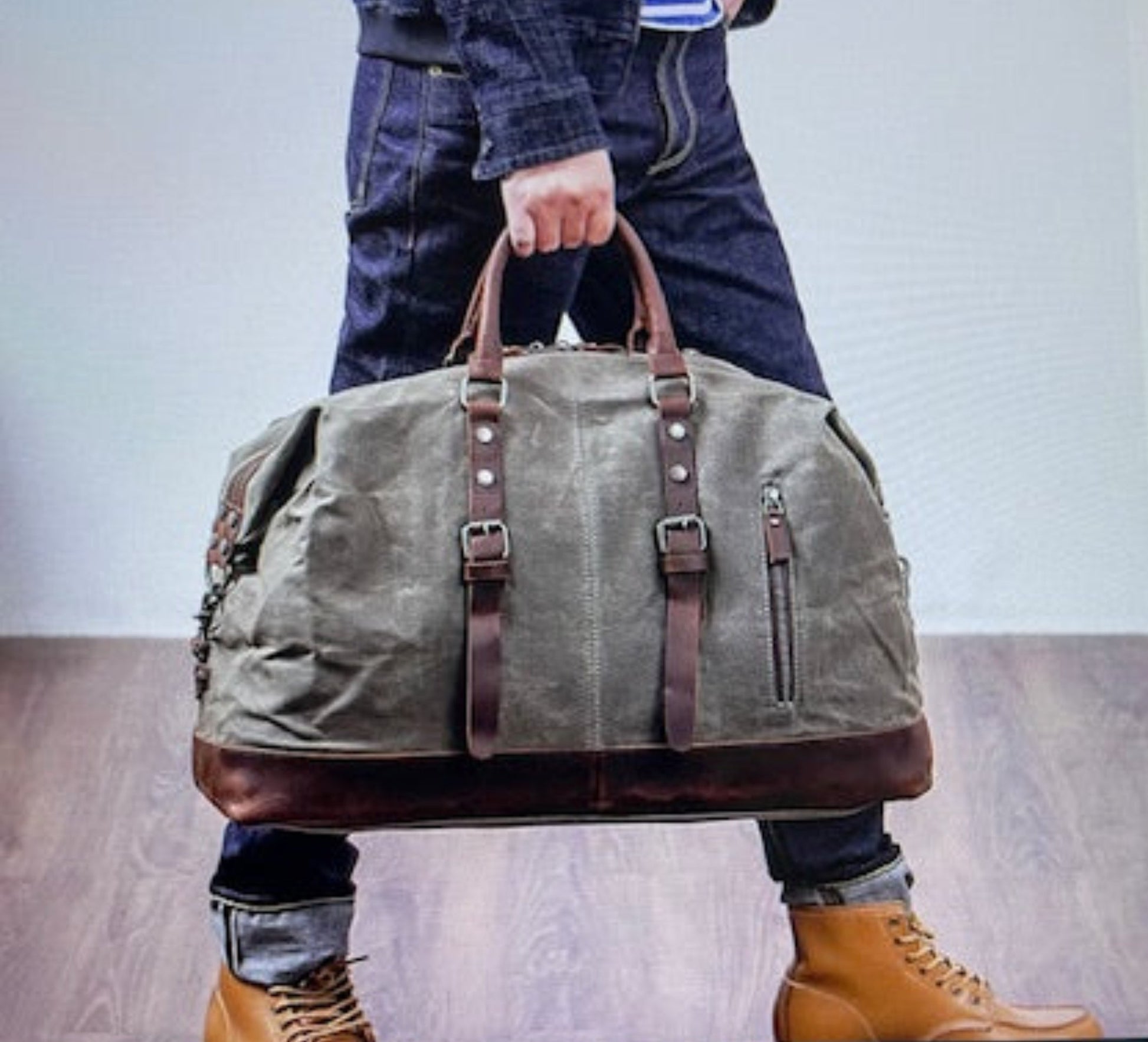 Small Duffle with Zip Pocket, leather handles and accents.