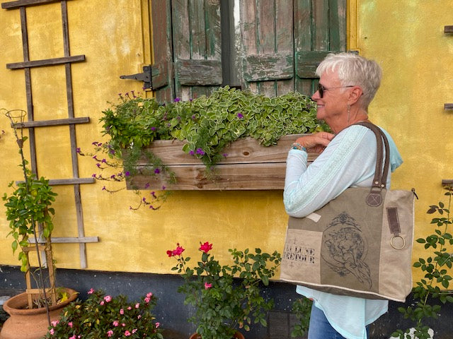 Woman with our shoulder tote bag of to the moon and back with sexy lady graphics