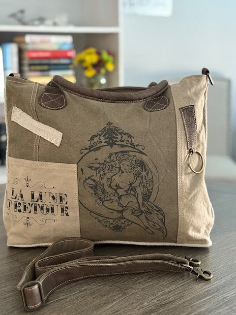 sexy lady on the moon in our recycled military tote bag with to the moon and back print in french