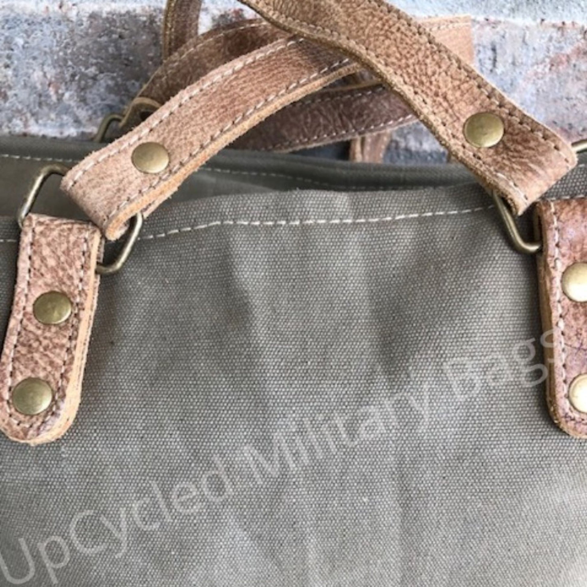 This UpCycled Oriver Winery Bag is constructed of repurposed military tent and tarp canvas. Bag Says : Oriver Winery, established 1972, Vineyards (in black distressed print). Durable enough to make every day an adventure yet still looks classy. Use as a small travel bag, everyday purse, or tote.