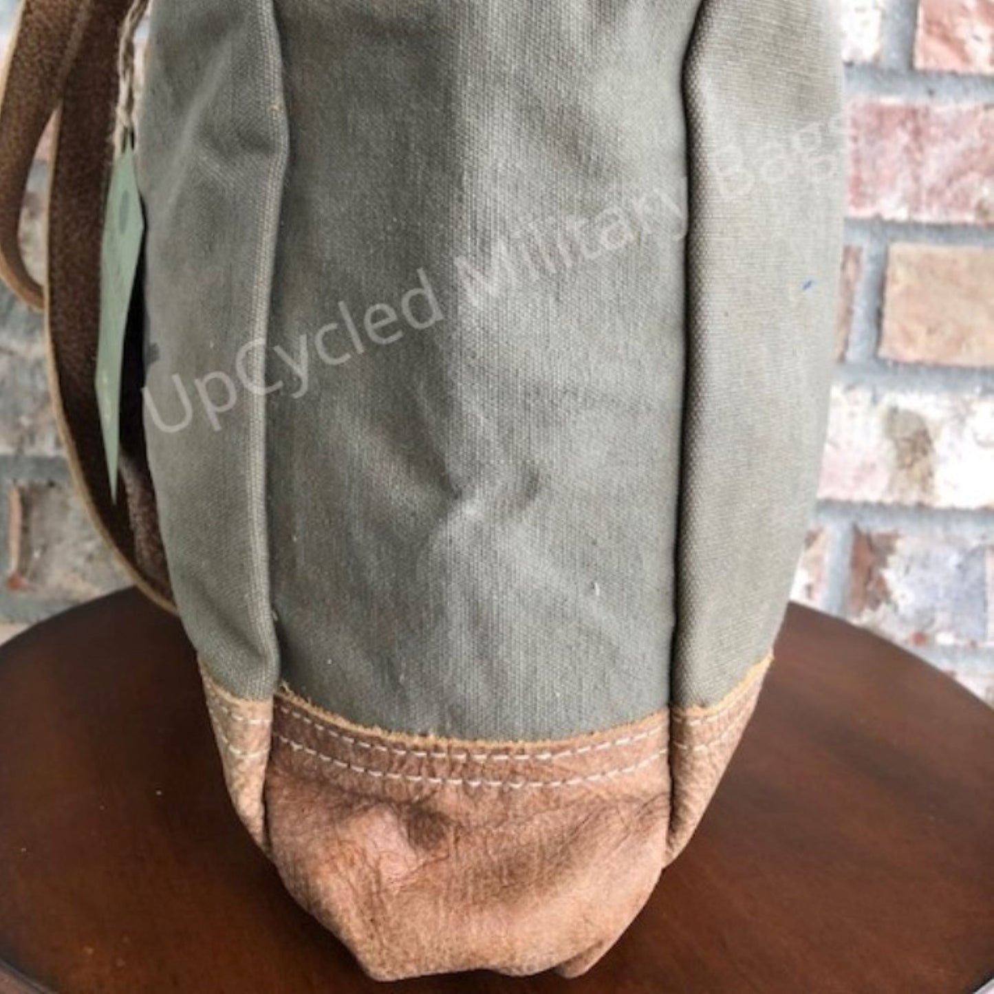 This UpCycled Oriver Winery Bag is constructed of repurposed military tent and tarp canvas. Bag Says : Oriver Winery, established 1972, Vineyards (in black distressed print). Durable enough to make every day an adventure yet still looks classy. Use as a small travel bag, everyday purse, or tote.